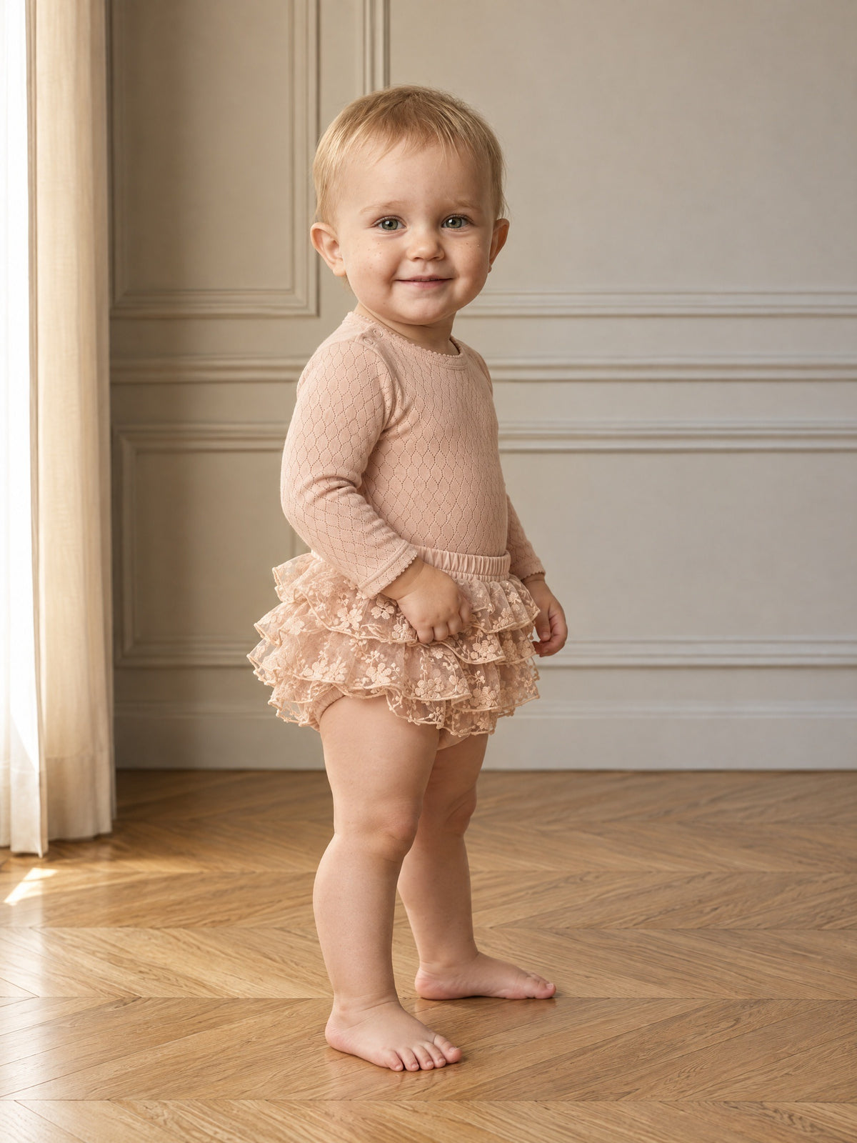 Girls' lightweight embroidered tulle bloomers with elastic waist and ruffled details.