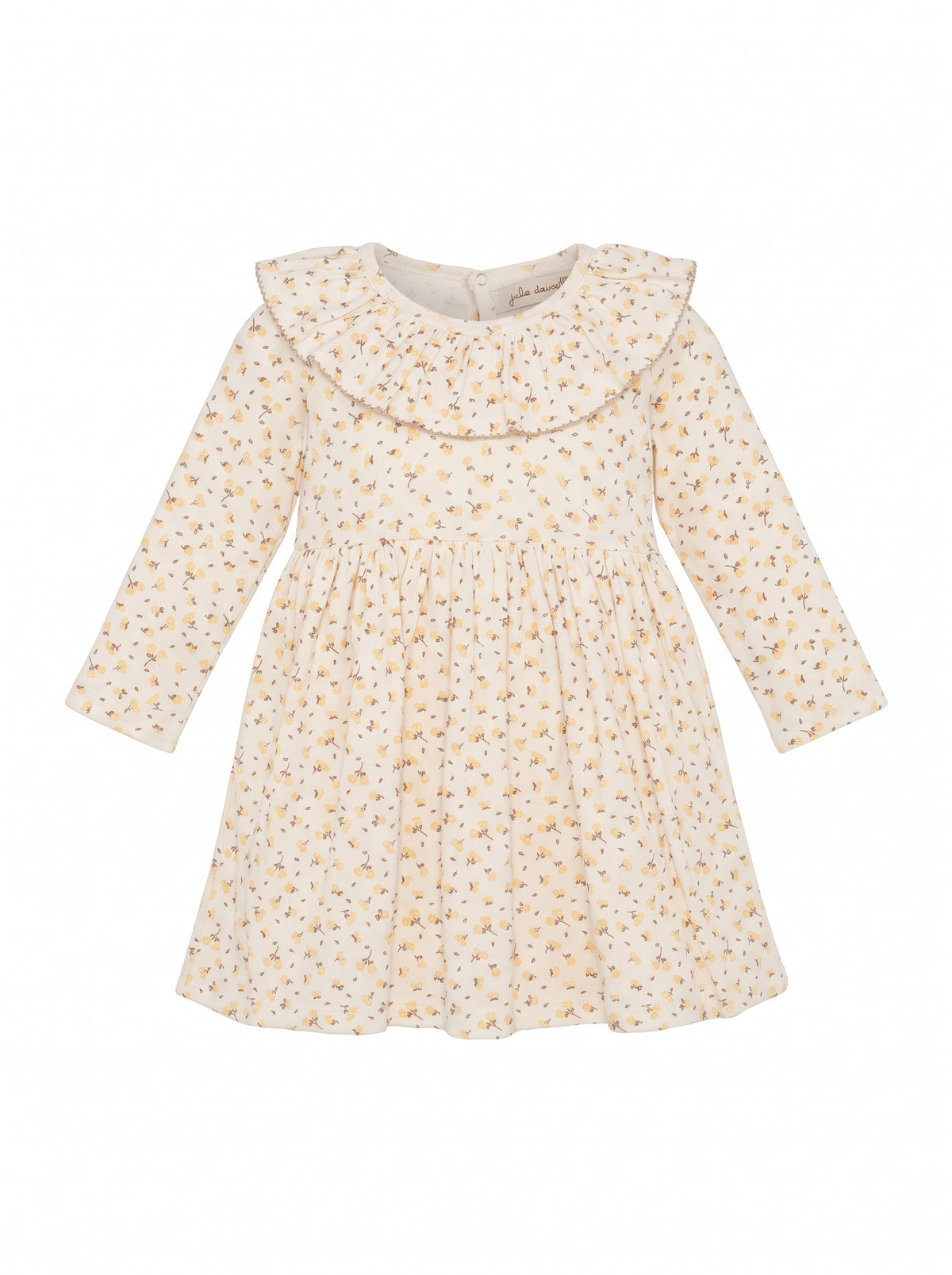 Child wearing a breathable cotton jersey style with a ruffled neckline, long sleeves, gathered waist, and all-over print.